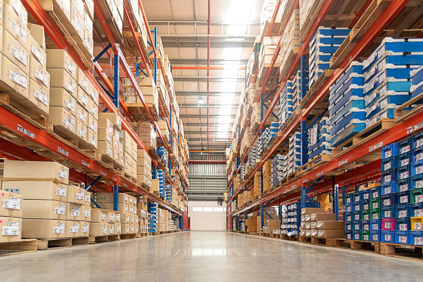 Shelves of shipping containers inside of a warehouse